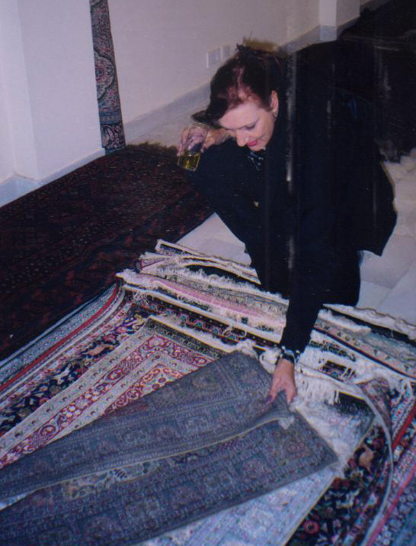Jane choosing her favorite rug for the bedside
