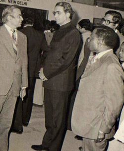 Mr. Talwar explaining the nuances of rug making while Mrs. Talwar looks on