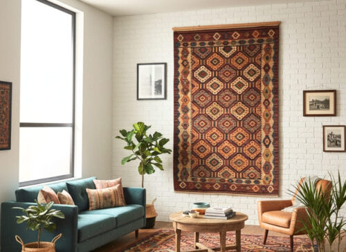 Why keep your Kilim to the floor? Kilim is a beautiful piece of weaving that can be used as a wall tapestry or a work of art. A Kilim on the wall is more than a mere addition to the room in terms of its rich colour and texture, a history of craftsmanship and culture to the wall. The concept is ideal for people who prefer bohemian or eclectic interiors and want to showcase their art in a non-traditional manner. Most of our Kilims at Yak Carpet were crafted by skilled weavers who applied the ancient methods in crafting our carpets, and their applications in such artistic presentations are ideal.
